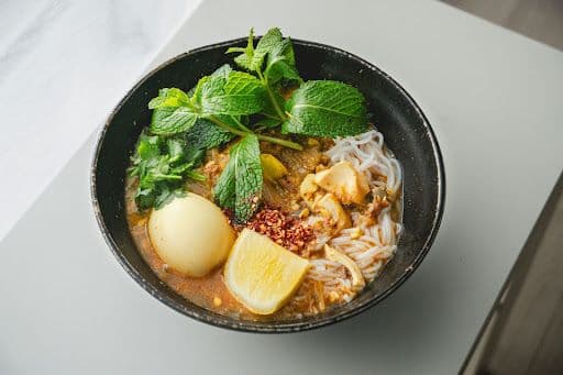 Authentic Penang Assam Laksa served in a bowl.